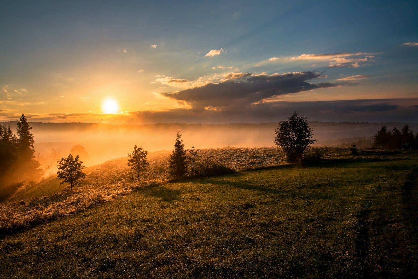 Sunrise over hills — a calm, open landscape